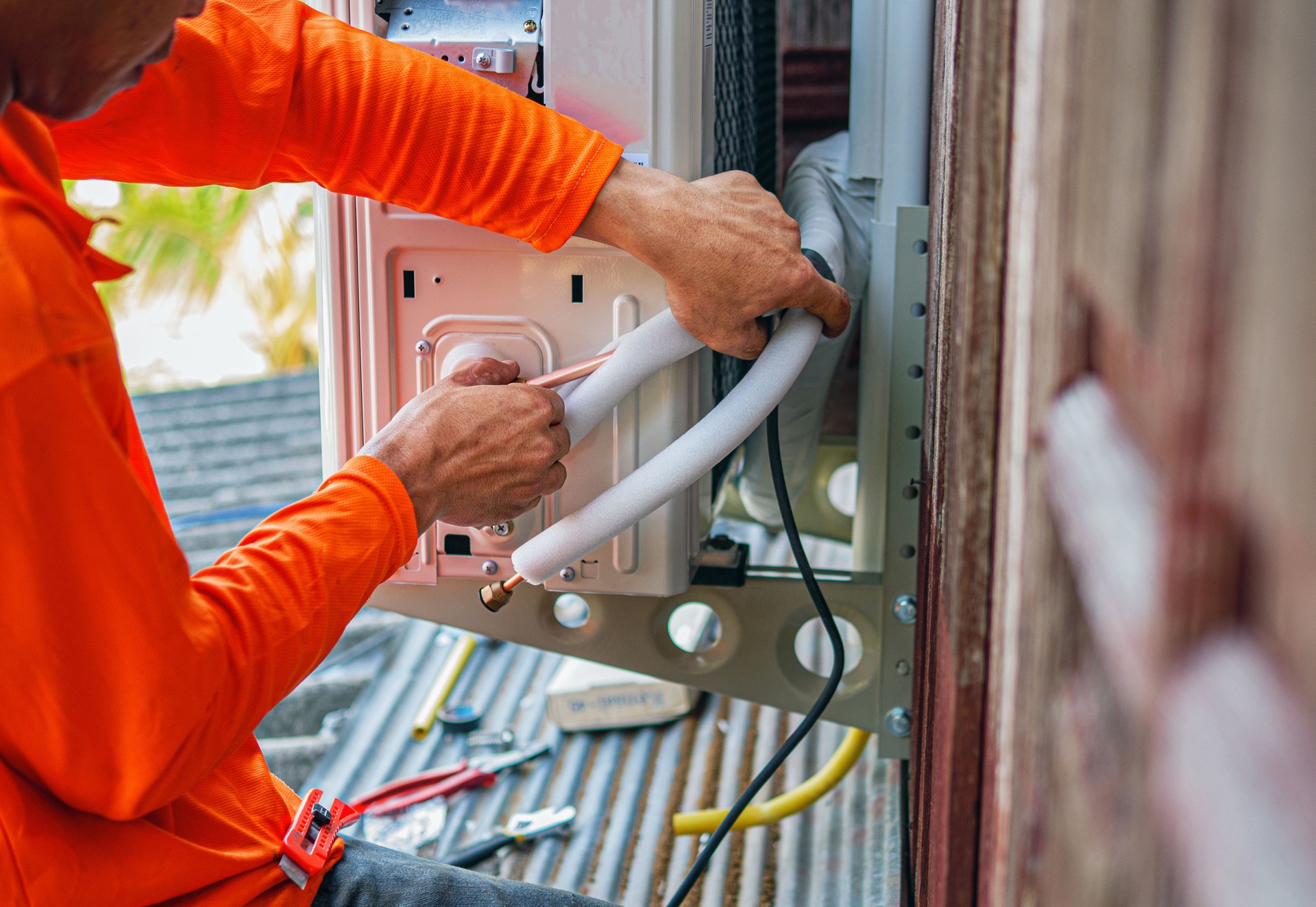 Air conditioning technicians install new compressor air in homes, Repairman fix air conditioning systems, Male technician service for repair and maintenance of air conditioners